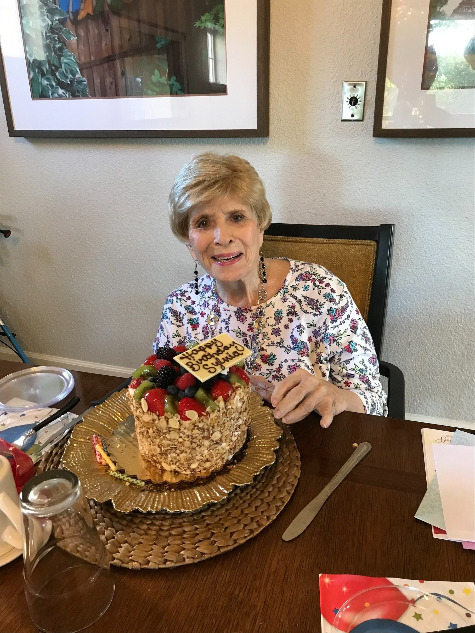Resident enjoying her birthday cake